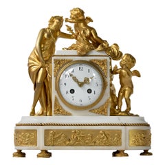 Reloj de chimenea francés Luis XVI del siglo XIX de bronce dorado y mármol