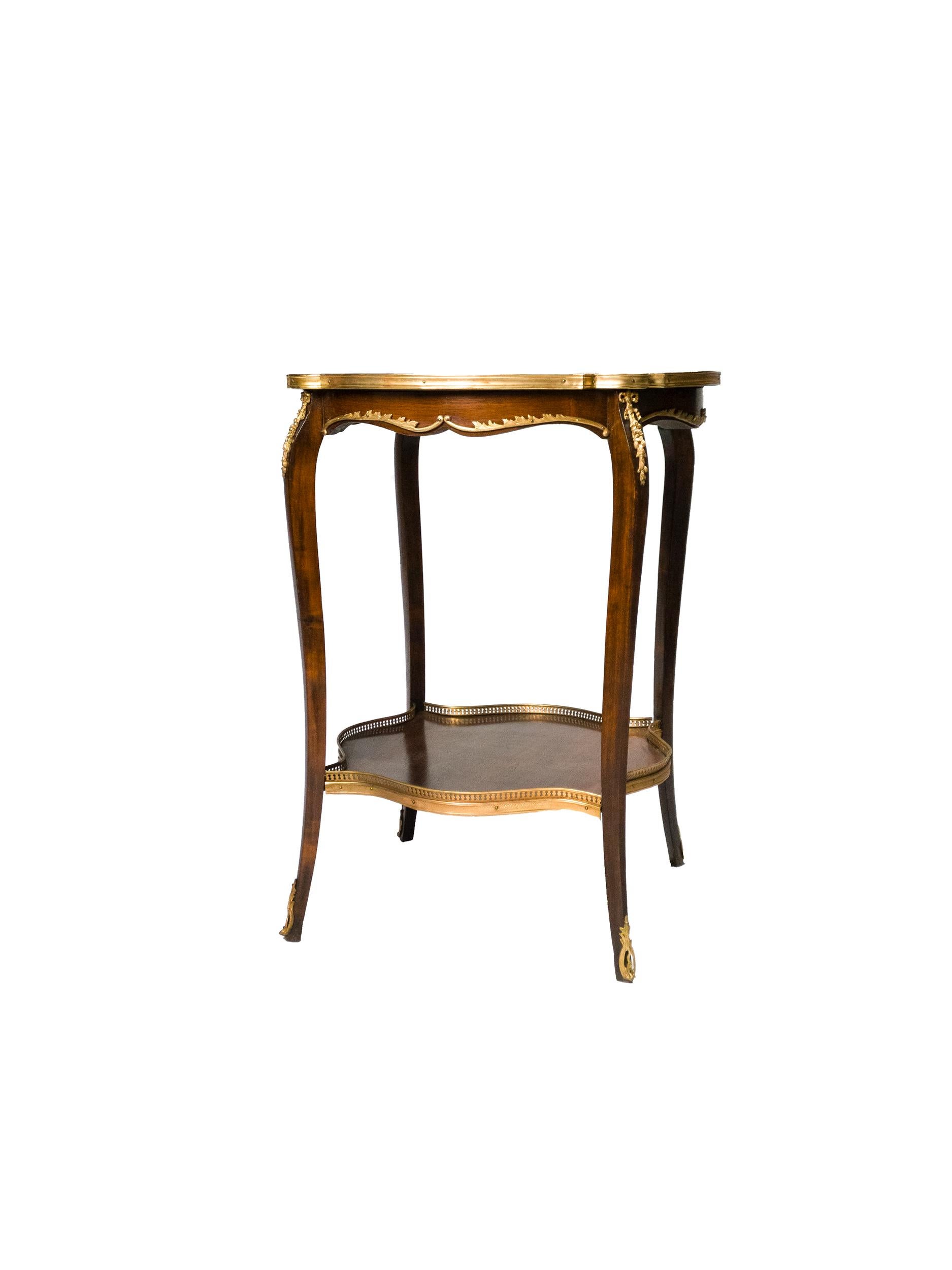 A 19th century Louis XV style kingwood gueridon side table raised on four cabriole legs with applied bronze mounts and rosewood marquetry at the top.

