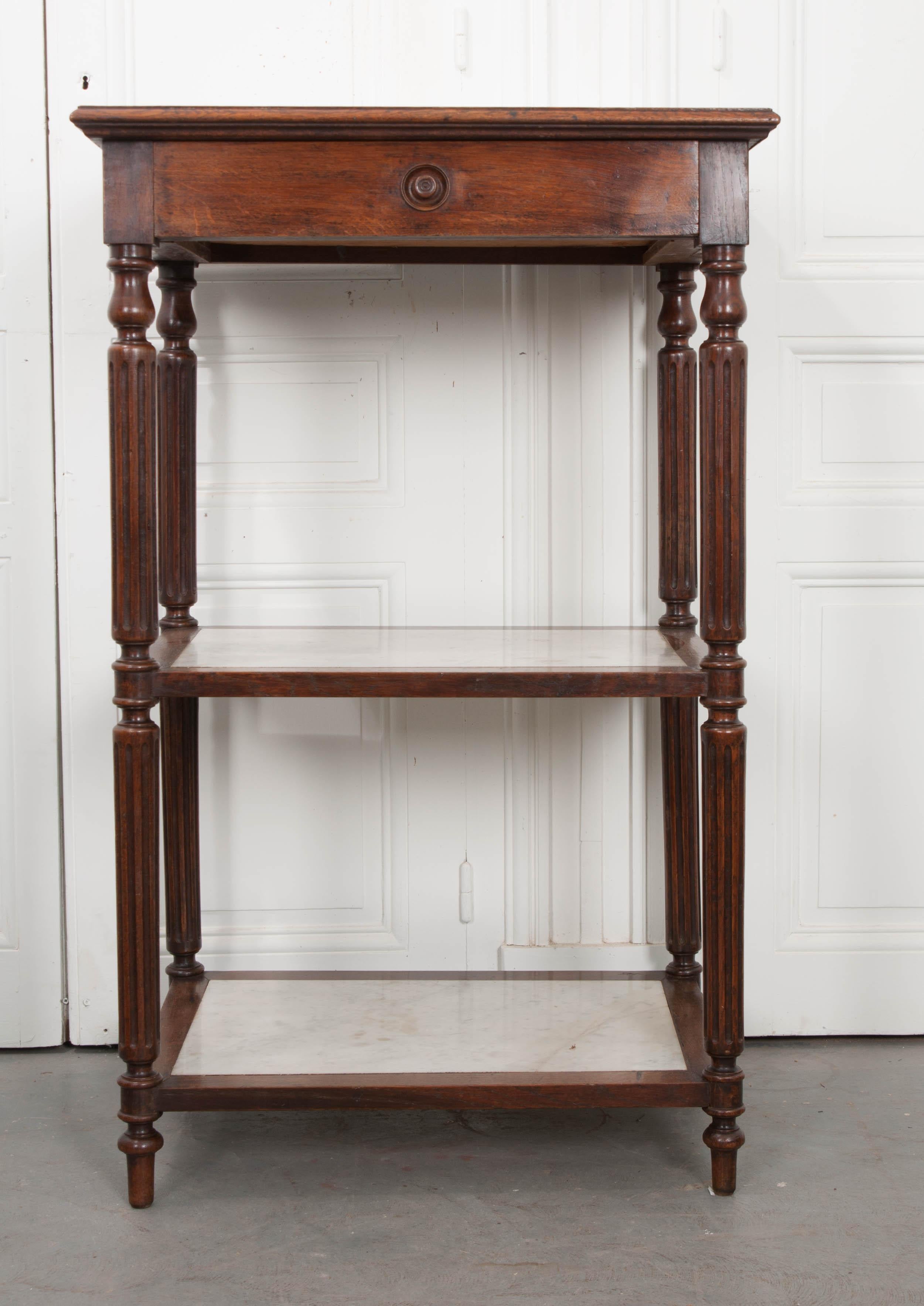 This handsome French 19th century three-tier étagère would make an attractive addition to any room whether for the display of collectibles in a den or for extra storage of towels in the bath.