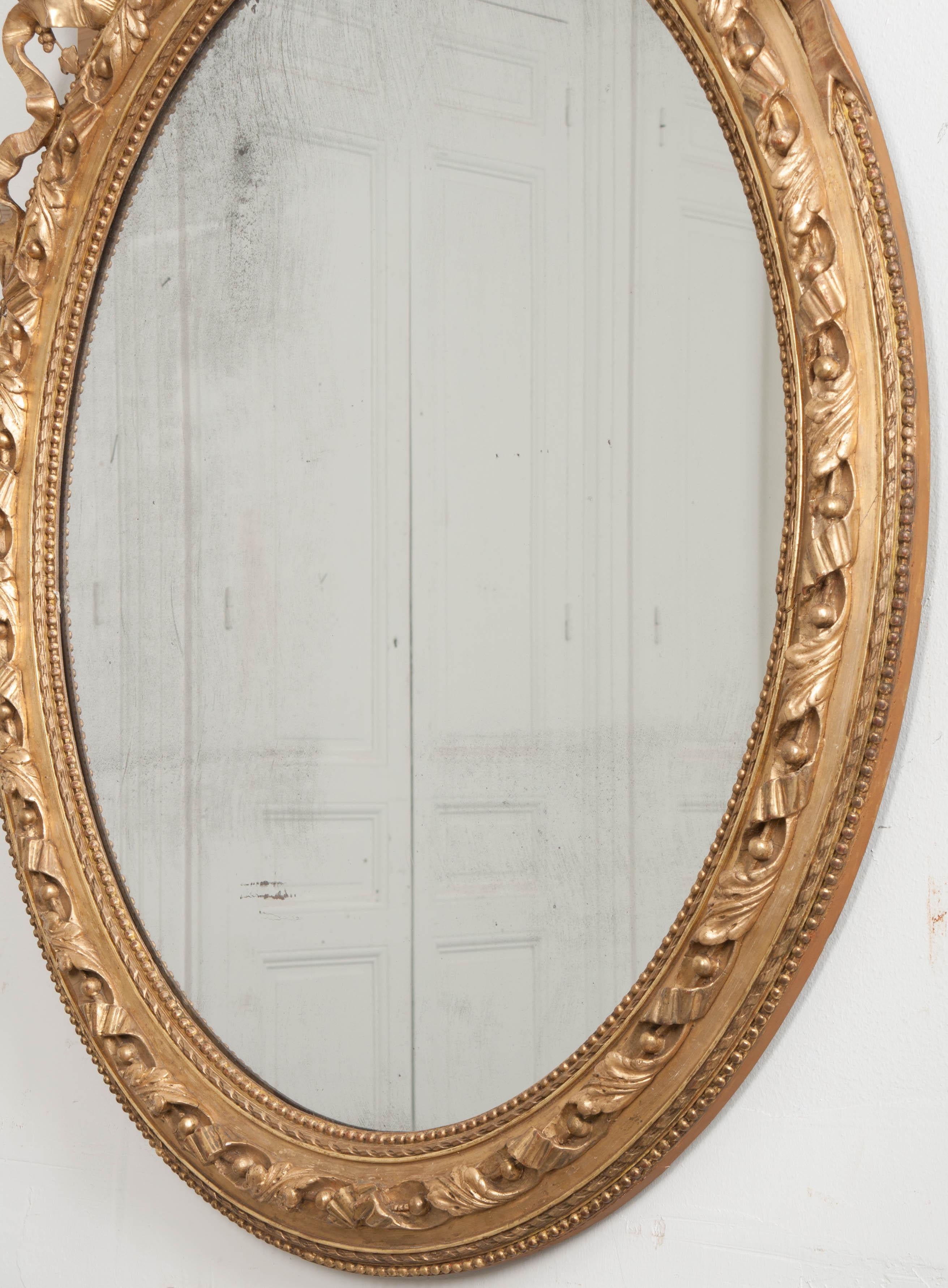 French 19th Century Louis XVI Oval Giltwood Mirror In Good Condition For Sale In Baton Rouge, LA