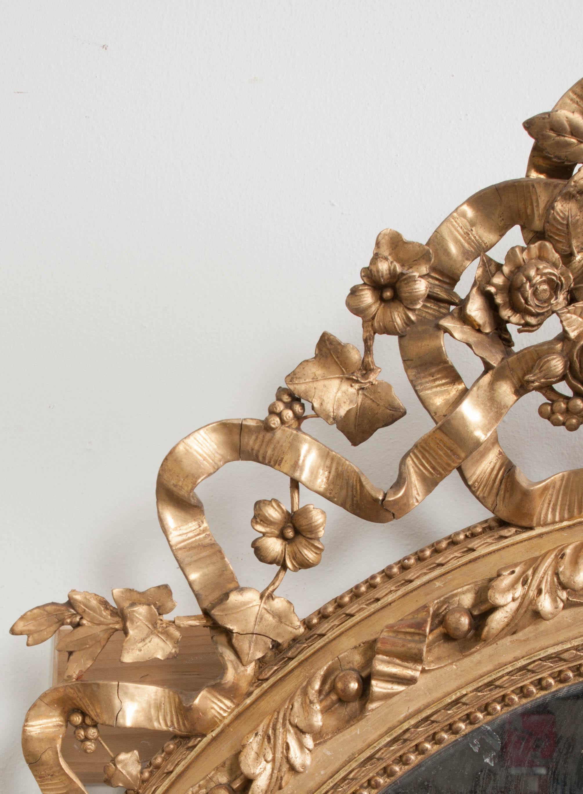 Miroir ovale Louis XVI français du 19ème siècle en vente 1