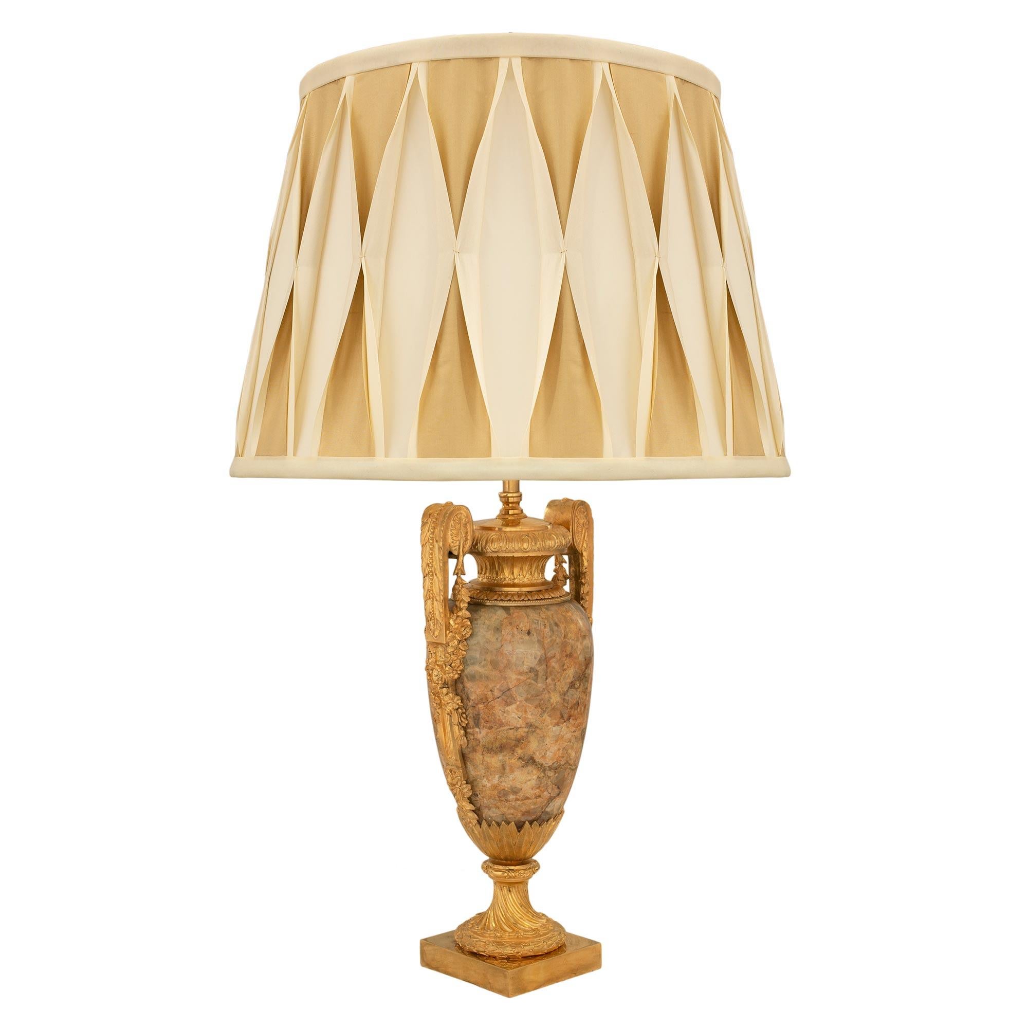 A striking and extremely elegant French 19th century Louis XVI st. Alabastro Fiorito Marble and ormolu lamp. The lamp is raised by an ormolu square base below the beautiful fluted spiral socle pedestal decorated with a wrap around berried laurel