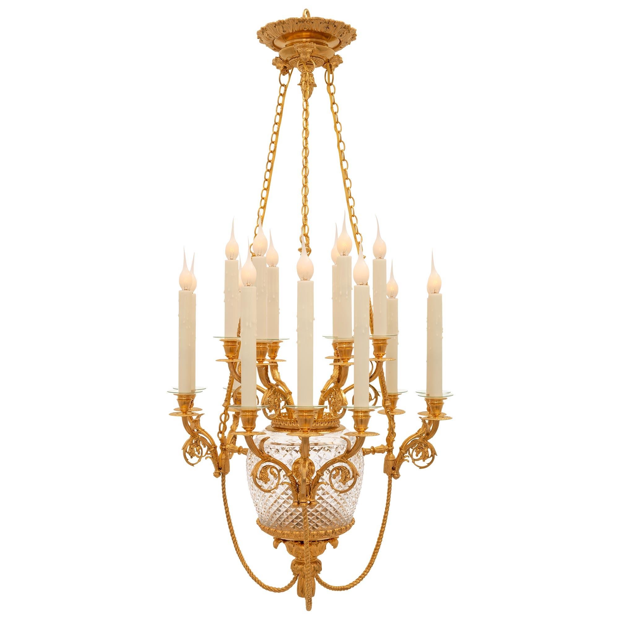 A stunning and most unique French 19th century Louis XVI st. Belle Époque period Baccarat crystal and ormolu chandelier. The fifteen arm chandelier is centered by a charming bottom finial of a tassel amidst acanthus leaves with three twisted rope