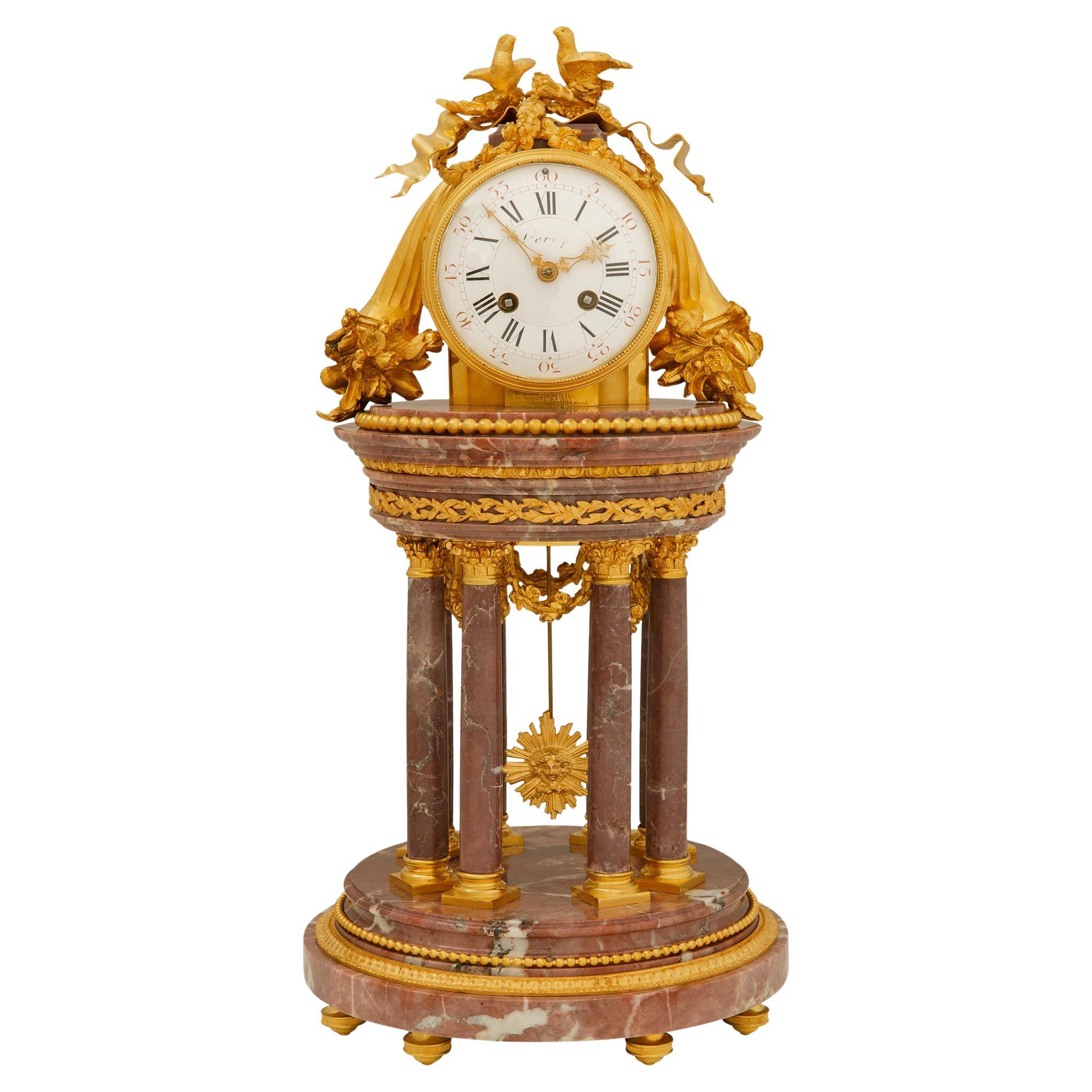French 19th century Louis XVI st. Breche Violette marble and Ormolu clock For Sale