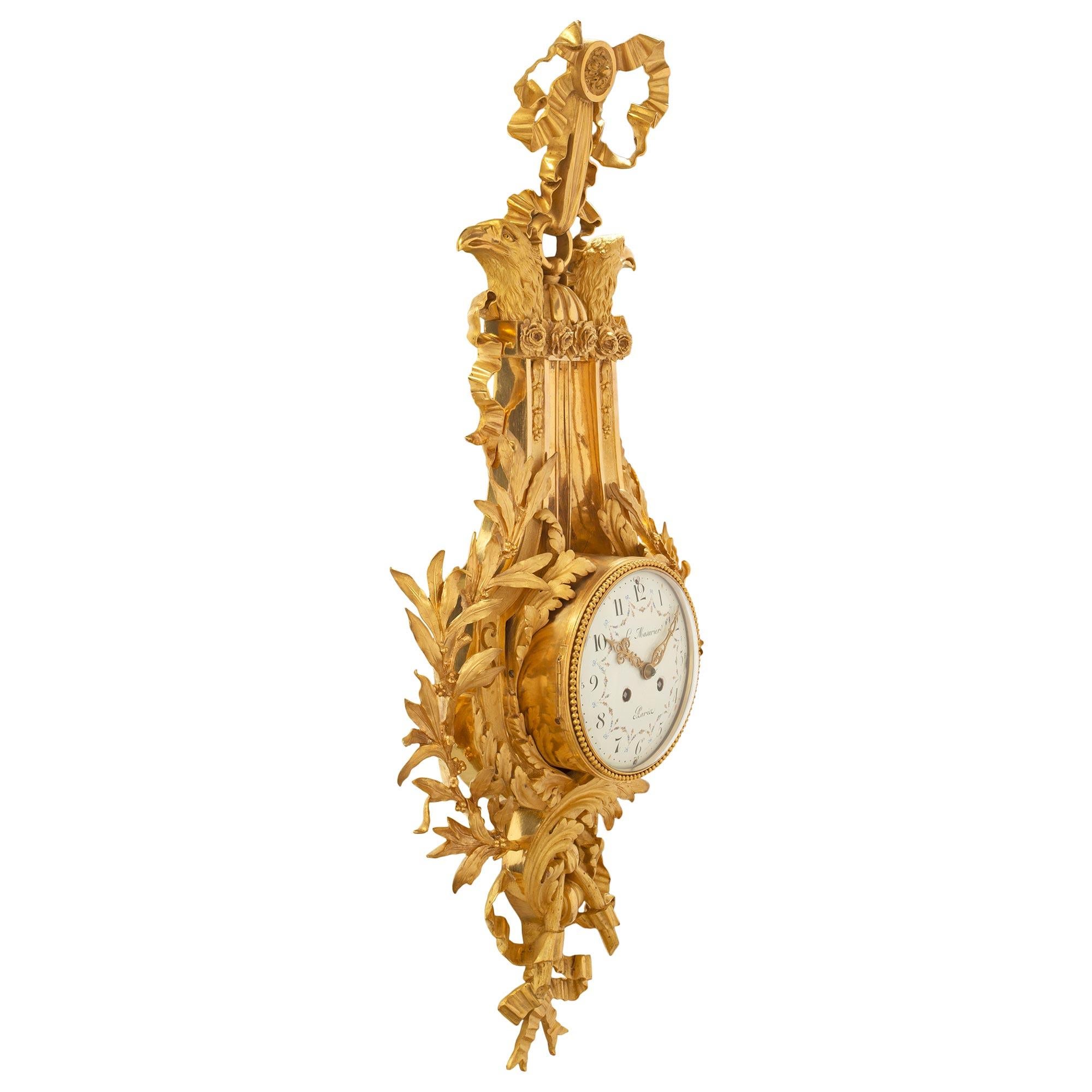 A most elegant and high quality French 19th century Louis XVI st. cartel clock, signed Le Masurier Paris. The richly chased ormolu case is in the shape of a lyre. At the bottom are tied berried laurel garlands which follow the contours of the clock