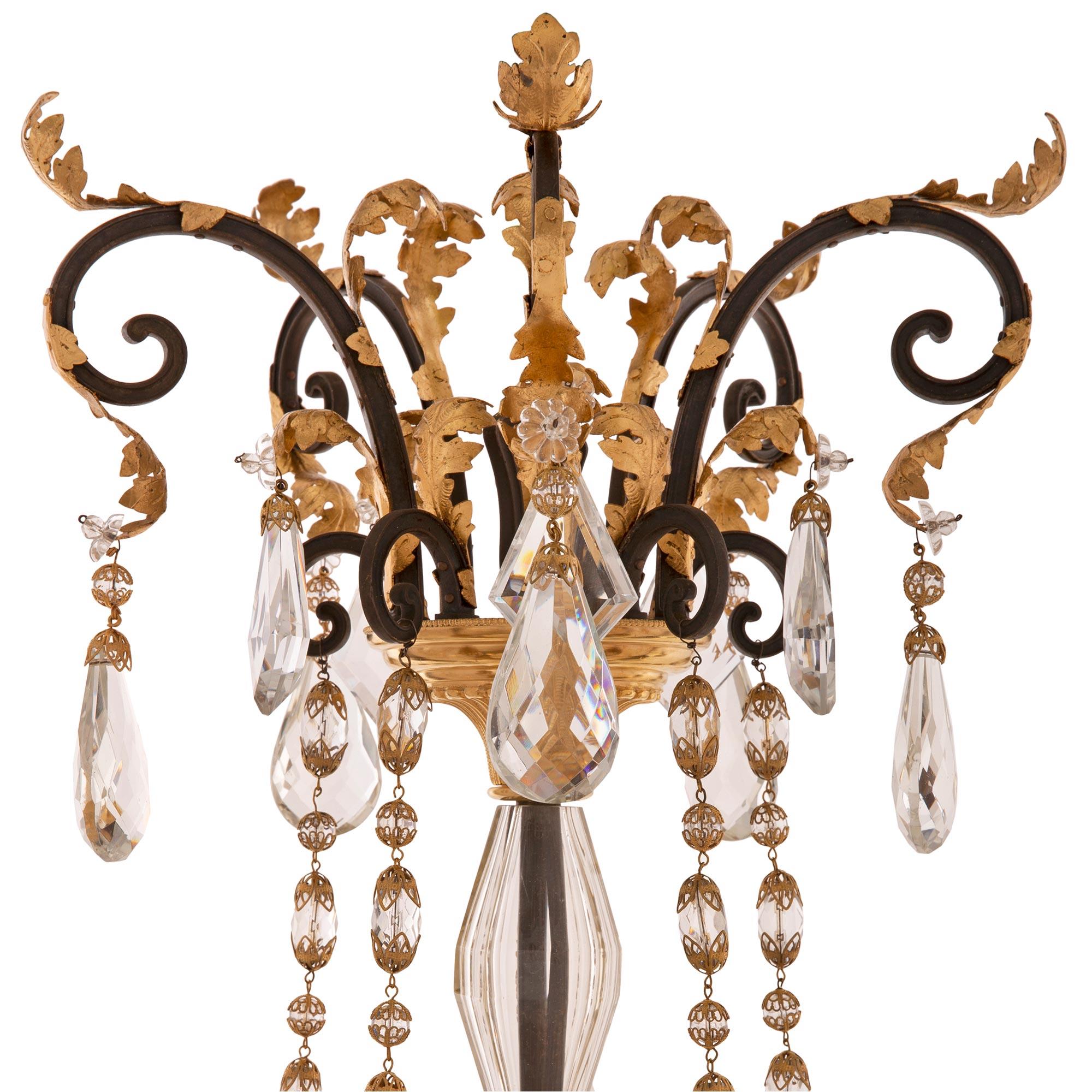 Gilt French 19th Century Louis XVI St. Crystal, Ormolu, and Wrought Iron Chandelier For Sale