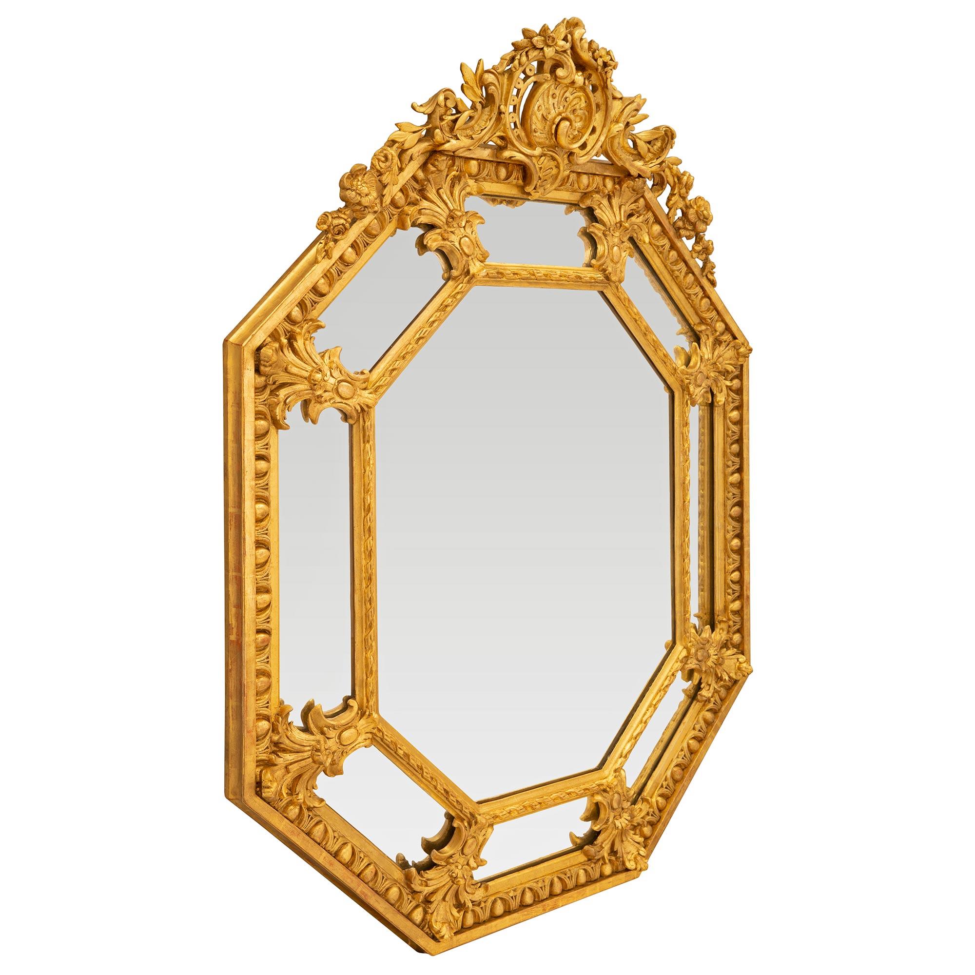 A striking French 19th century Louis XVI st. double framed octagonal giltwood mirror. The mirror retains all of its original mirror plates throughout with the central plate framed within a lovely finely detailed twisted ribbon wrap around band while
