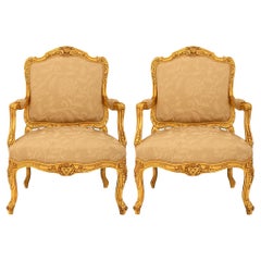 Antique French 19th century Louis XV st. Giltwood armchairs