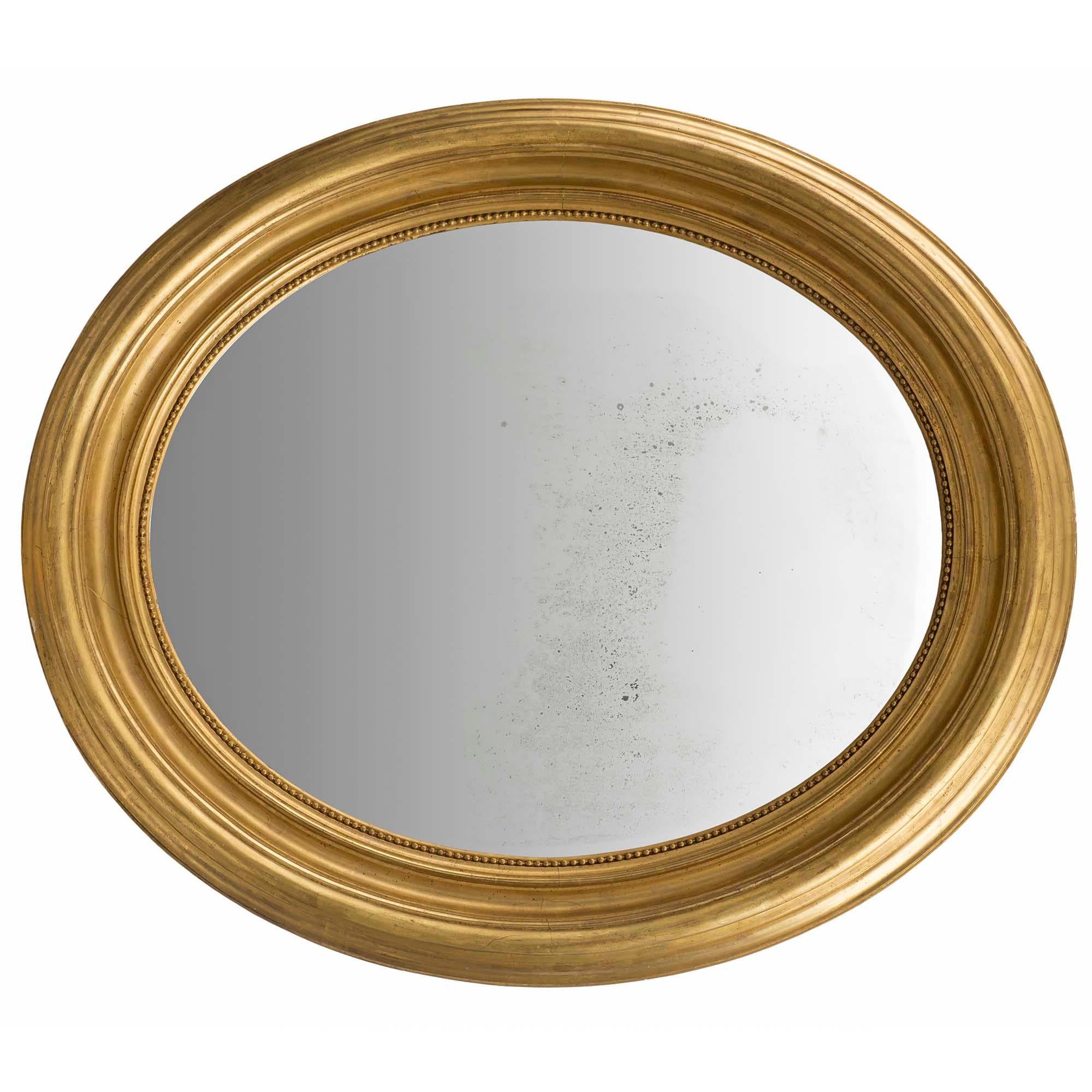 XIXe siècle Miroir ovale français du 19ème siècle en bois doré de style Louis XVI en vente