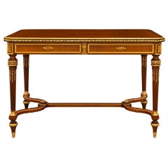 Bureau français du XIXe siècle de style Louis XVI en acajou, bois de roi, bois de satin et bronze doré