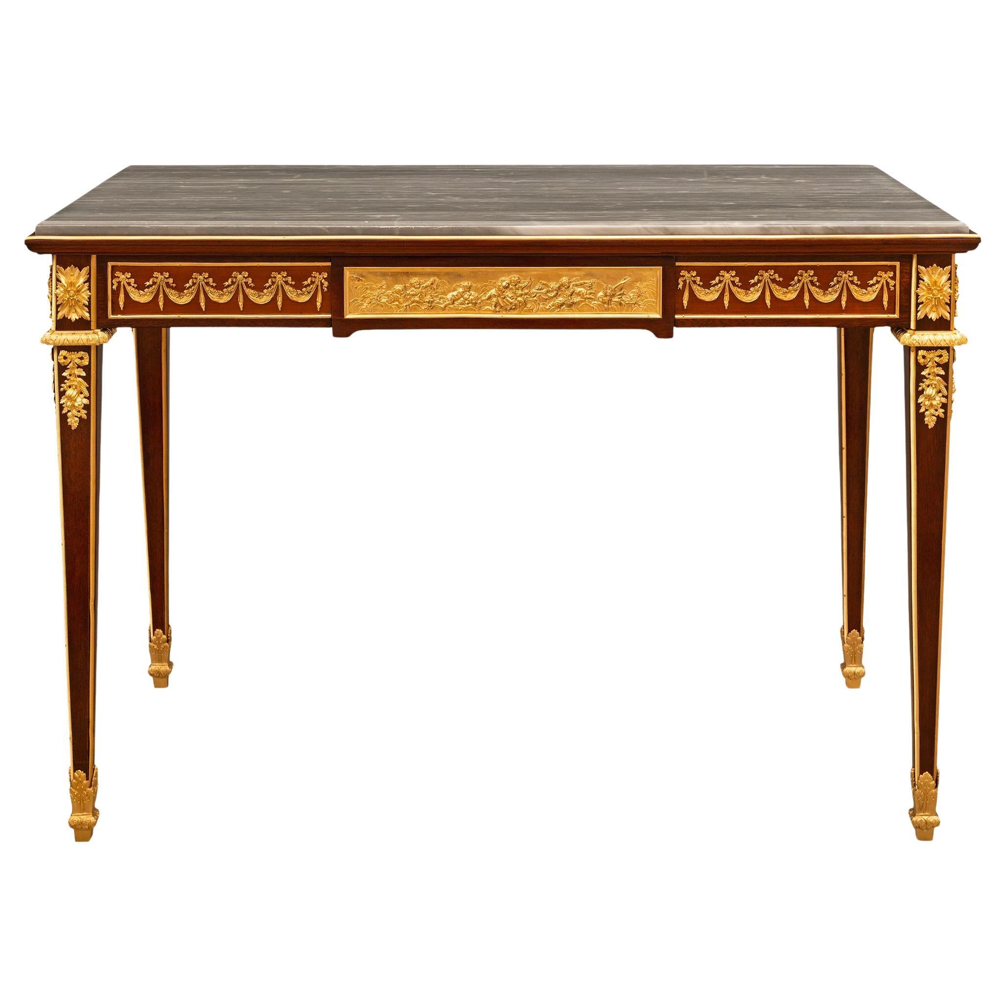 Bureau/table français du XIXe siècle de style Louis XVI en acajou, bronze doré et marbre 