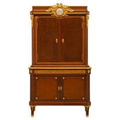 French 19th Century Louis XVI St. Mahogany, Tulipwood and Ormolu Clock Cabinet