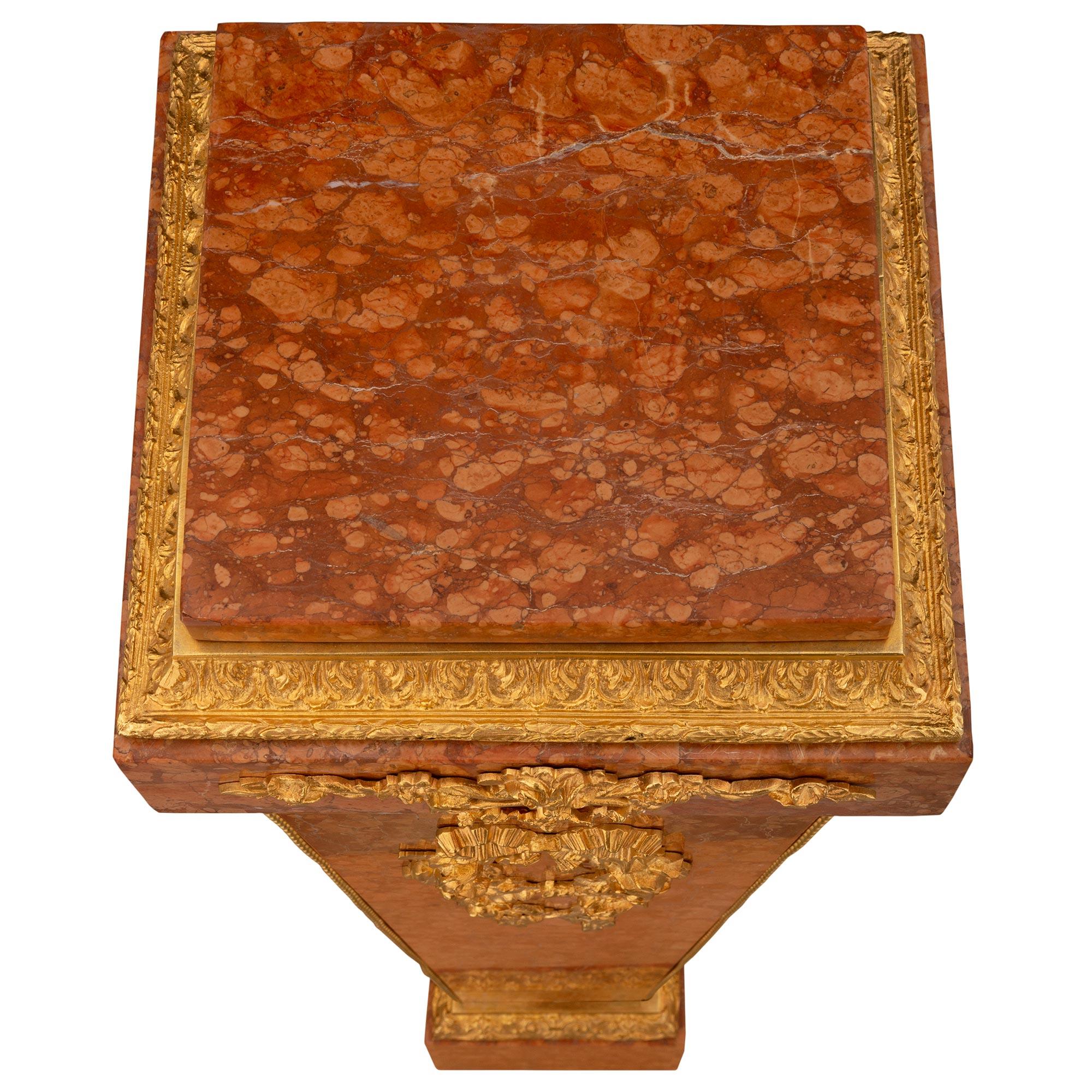 An exceptional French 19th century Louis XVI st. Rouge Griotte, Campan Rubané, Brèche de Sicile marble, Granite and ormolu pedestal column. The column is raised by a square Brèche de Sicile marble base with a beautiful richly chased mottled foliate