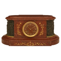 French 19th century Louis XVI st. Marble, patinated Bronze and Ormolu clock