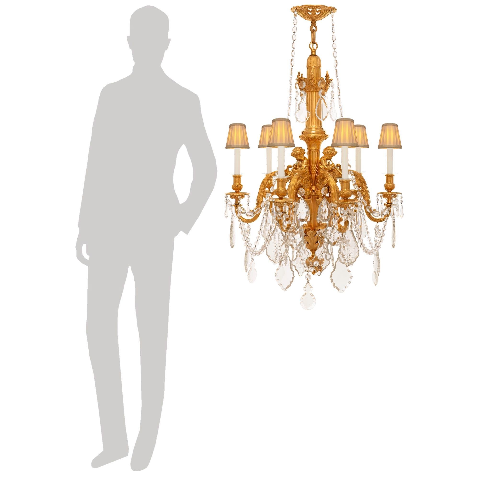An impressive and high quality French 19th century Louis XVI st. Ormolu and Baccarat Crystal chandelier, after the model by Pierre Gouthière for Marie Antoinette. This truly gorgeous six light chandelier is centered by a berried acorn bottom finial
