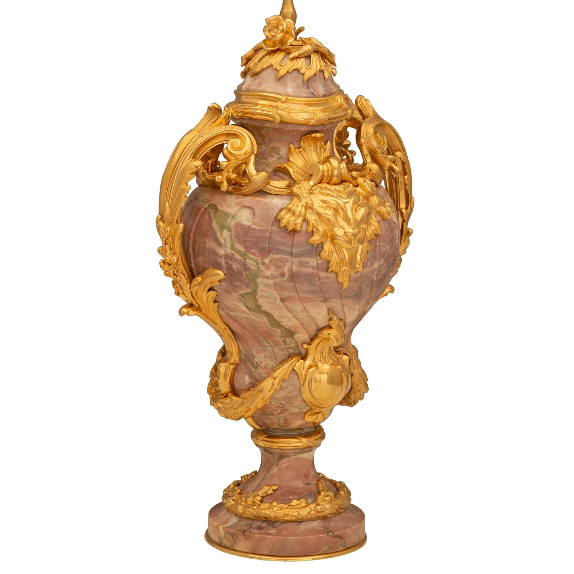 A beautiful French 19th century Louis XVI st. ormolu and Brèche Violette marble lamp. The lamp is raised by an elegant circular base with a lovely curved shape, a fine bottom ormolu fillet, and a striking wrap around oak leaf band with charming