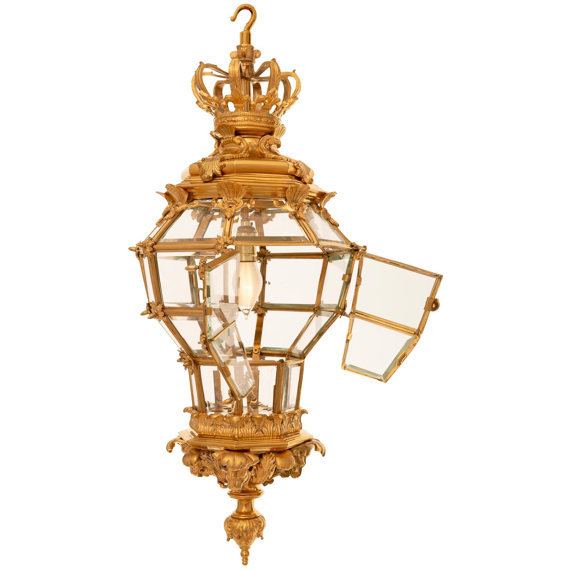 A spectacular and high quality French 19th century Louis XVI st. Ormolu and Crystal lantern. The lantern is modeled off an antechamber lantern still situated in the Palais de Versailles which was featured in Henry Havard's 19th century Ameublement