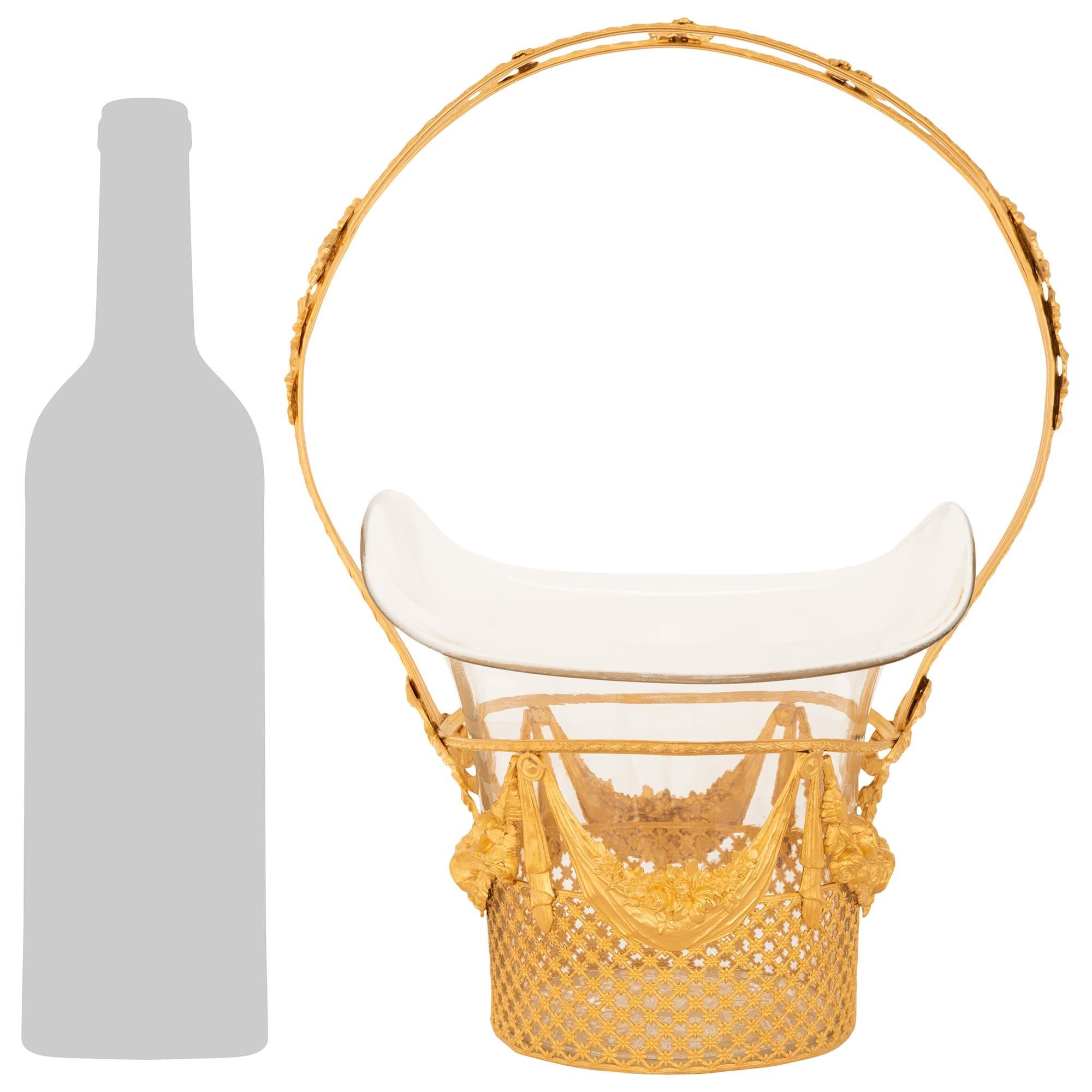 An exquisite and most elegant French 19th century Louis XVI st. Ormolu and Glass centerpiece basket. This lovely 