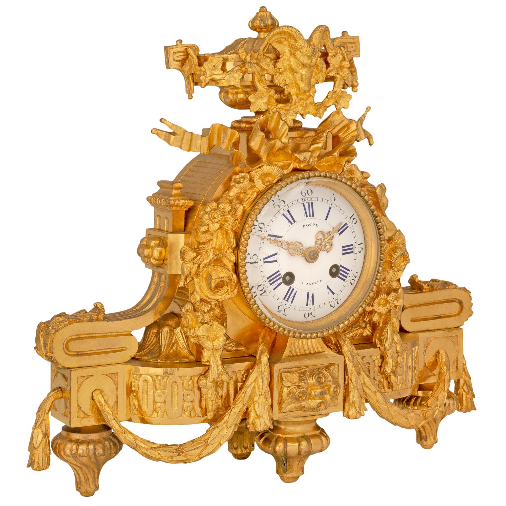 An exceptional French mid 19th century Louis XVI st. ormolu clock, signed Bozzo, A. Angers and stamped Japy Freres Médaille d'Or 1855. The clock is raised by four elegant topie shaped feet with fluted designs below striking block reserves. Richly