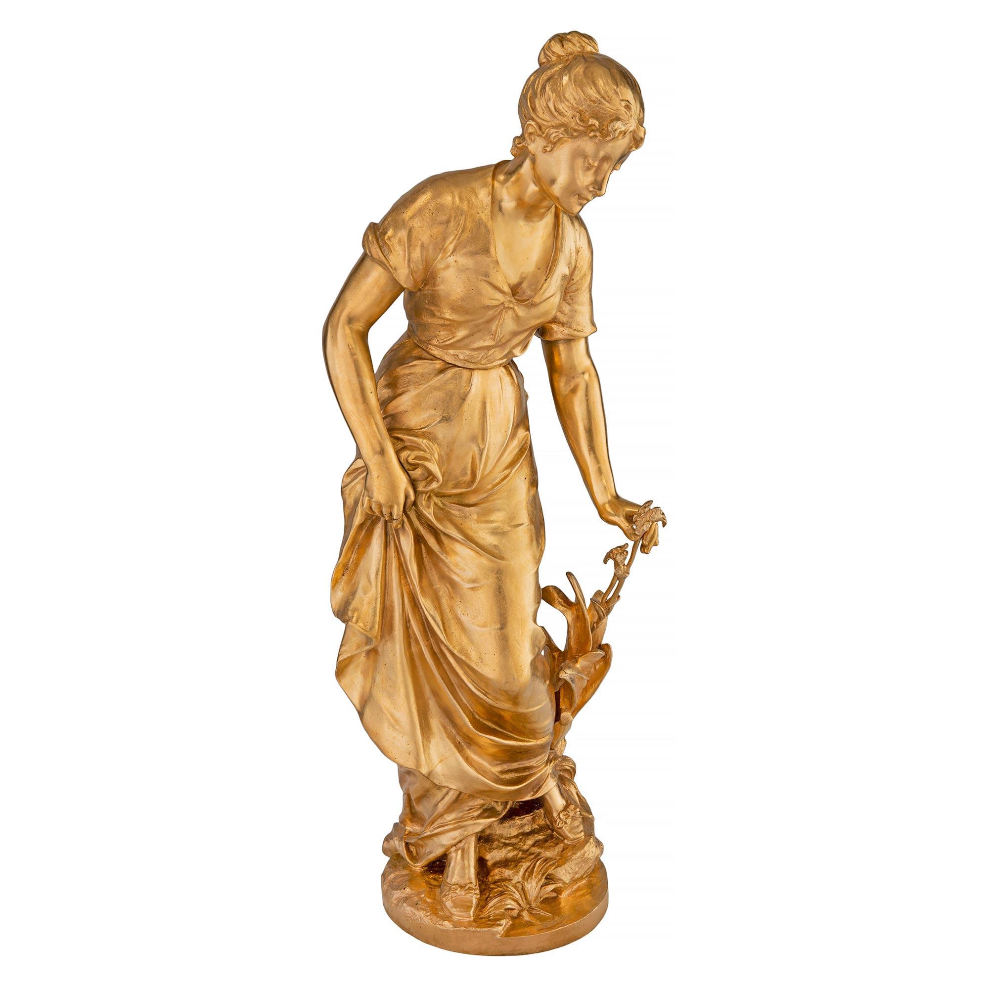 A superb French 19th century Louis XVI st. ormolu statue of a beautiful maiden, signed S. Kinsburger. The statue is raised by a wonderfully executed terrain designed base, where the lovely lady is standing. She is wearing a charming flowing dress