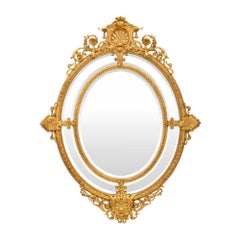 Miroir ovale français du 19ème siècle de style Louis XVI à double cadre en bois doré