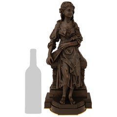 French 19th century Louis XVI st. patinated Bronze and Ormolu statue