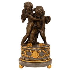 San Luis XVI francés del siglo XIX de bronce patinado, ormolu y mármol