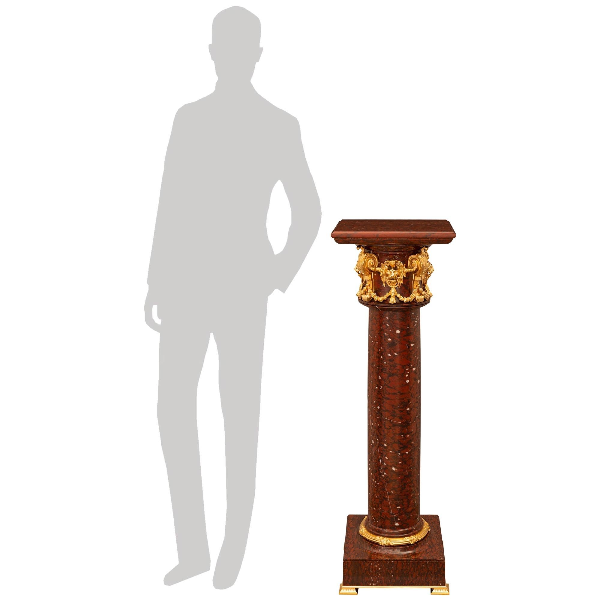 An impressive and high quality French 19th century Louis XVI st. Rouge Griotte marble and Ormolu pedestal. This beautiful pedestal is raised on a square marble block supported on an Ormolu base plate with four square feet containing short fluted