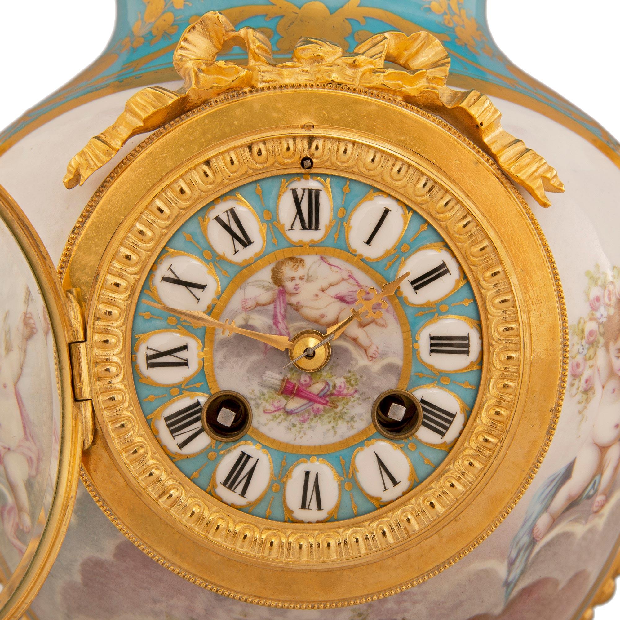 A beautiful and most unique French 19th century Louis XVI st. Sèvres porcelain and ormolu clock lamp. The clock/lamp is raised by an elegant square ormolu base with concave corners, lovely scalloped sides and decorated with charming vines tied with