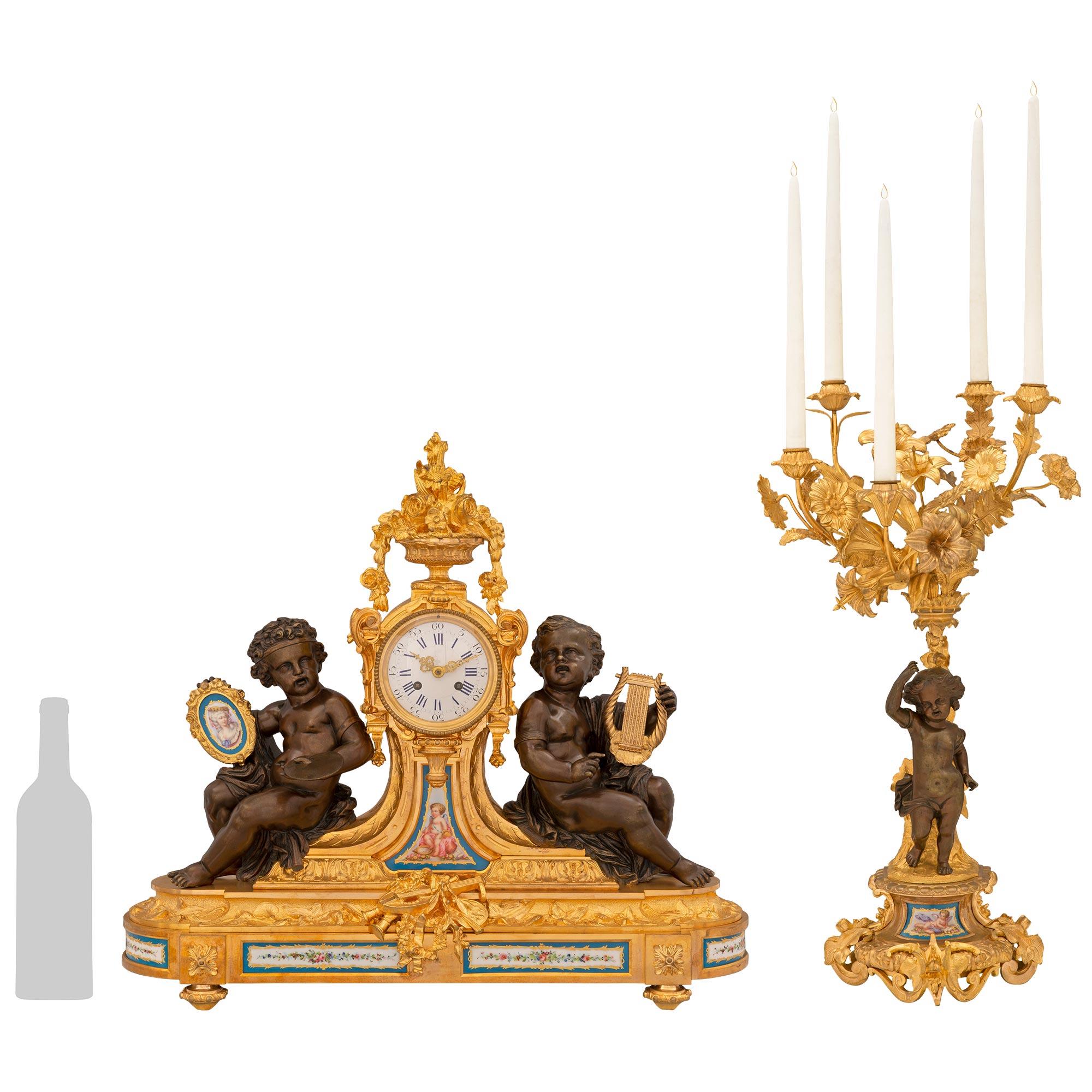 A magnificent and high quality French 19th century Louis XVI st. Sévres Porcelain, patinated Bronze and Ormolu garniture set. This stunning set consisting of a central clock and two candelabras are raised on wonderful Ormolu bases, with the clock