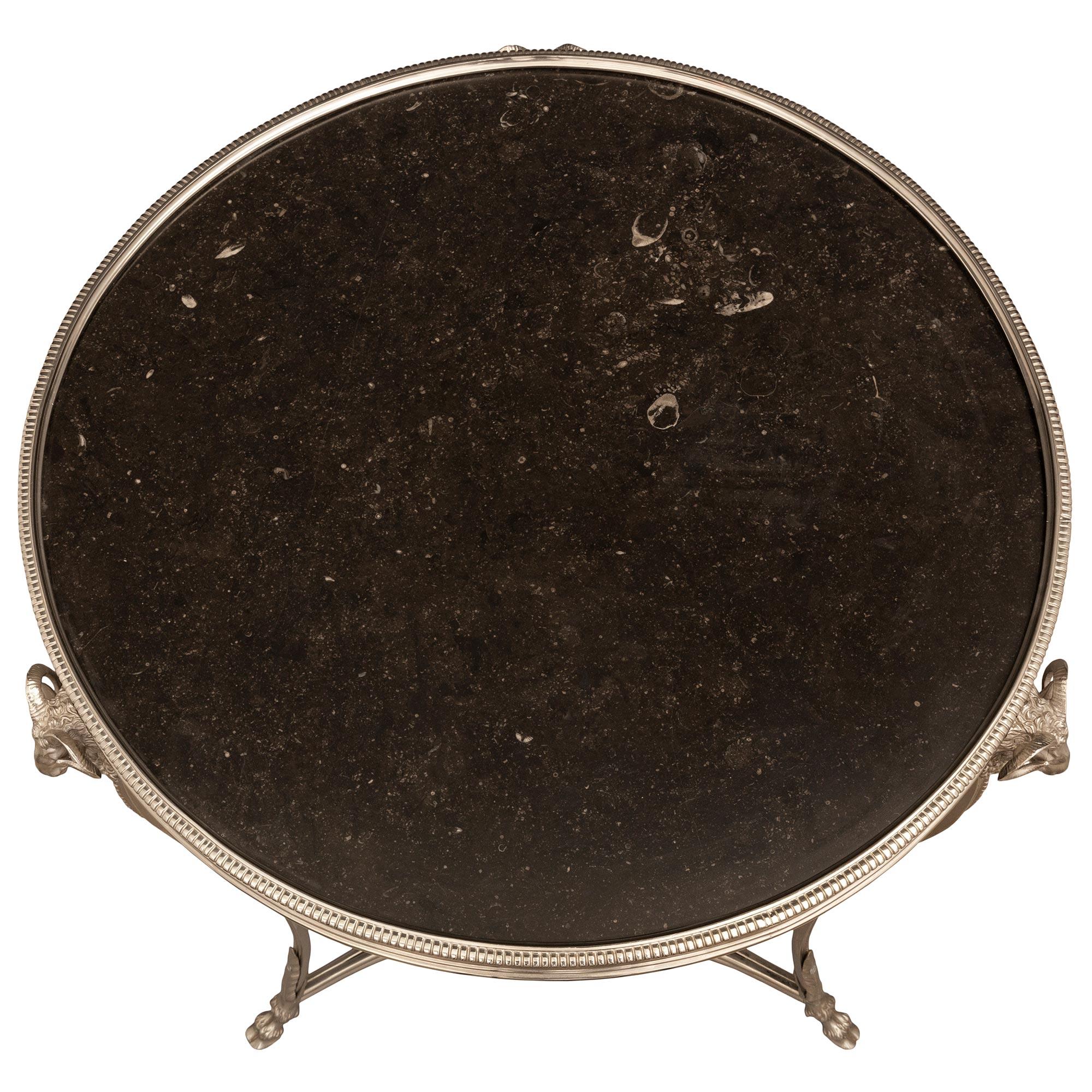 A most elegant and high quality French 19th century Louis XVI st. silvered bronze and black Belgian marble Guéridon side table. The table is raised by handsome finely detailed hoof feet with large acanthus leaves and three beautifully scrolled