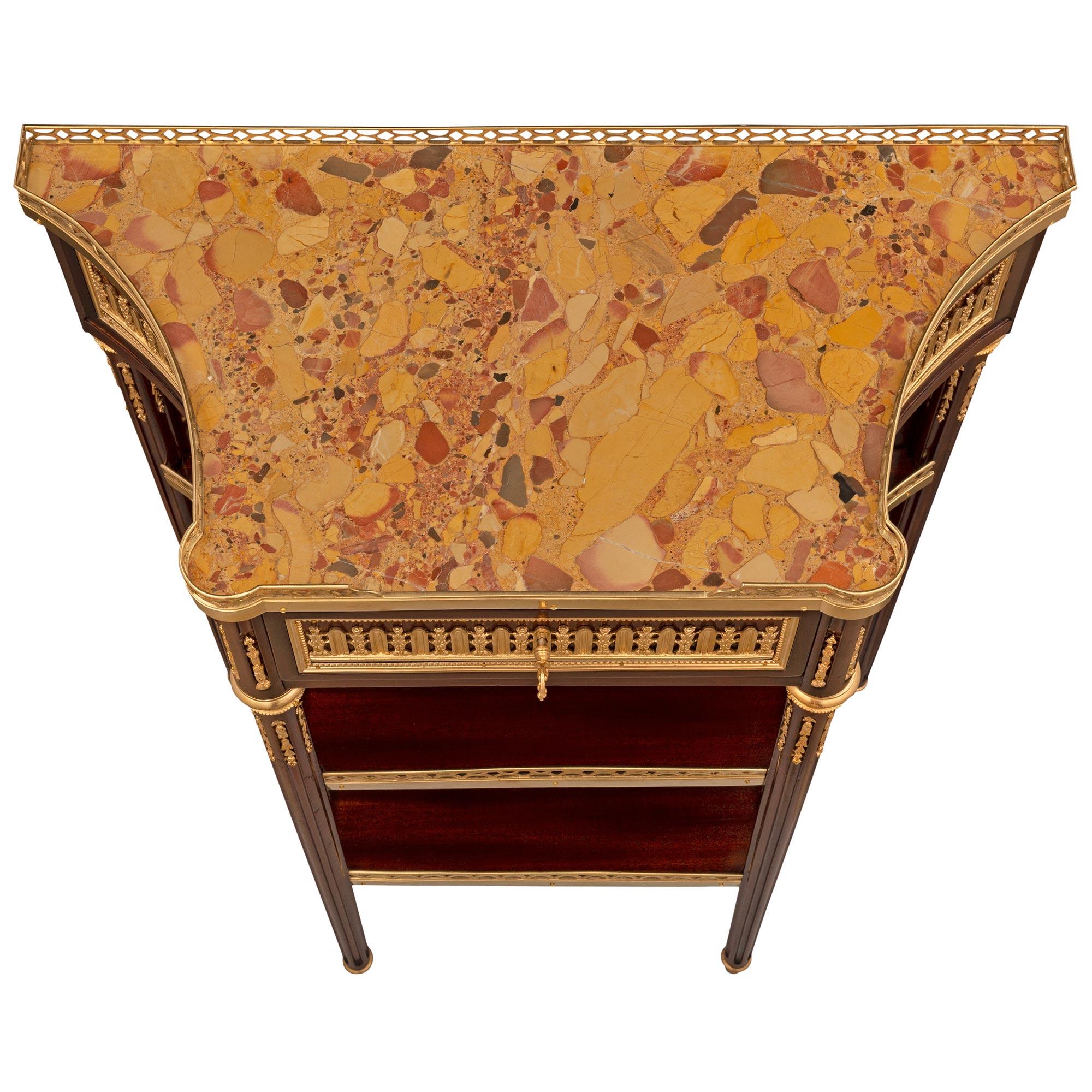 A most elegant and high quality French 19th century Louis XVI st. Belle Époque period mahogany, ormolu and Brèche d'Alep marble console, signed by Paul Sormani. The console is raised by fine circular tapered fluted supports with lovely ball topie