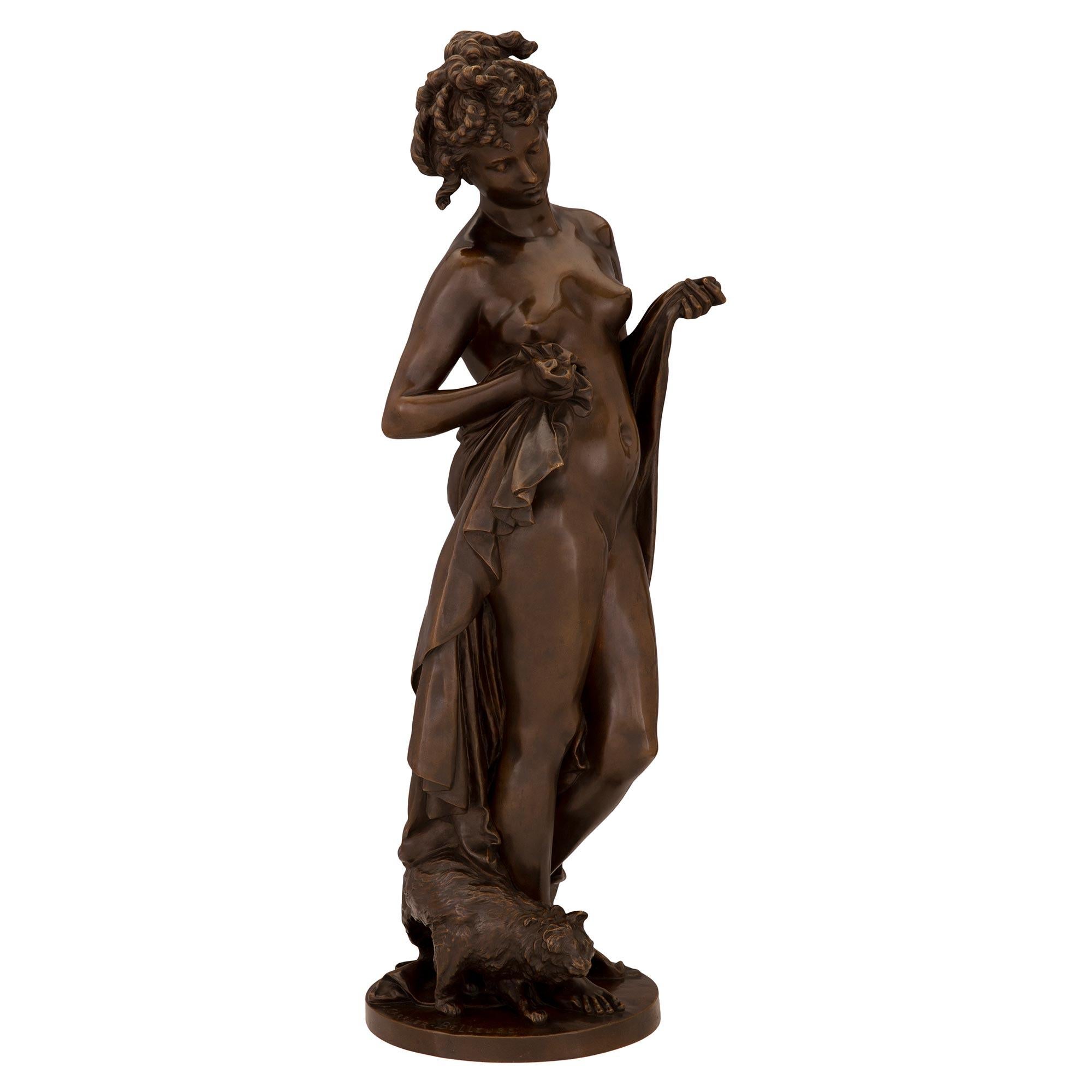 An impressive and high quality French 19th century Louis XVI st. patinated bronze statue, signed A. Carrier Belleuse. The statue is raised by a circular base with a ground like design where the signature is displayed. Above is the beautiful maiden