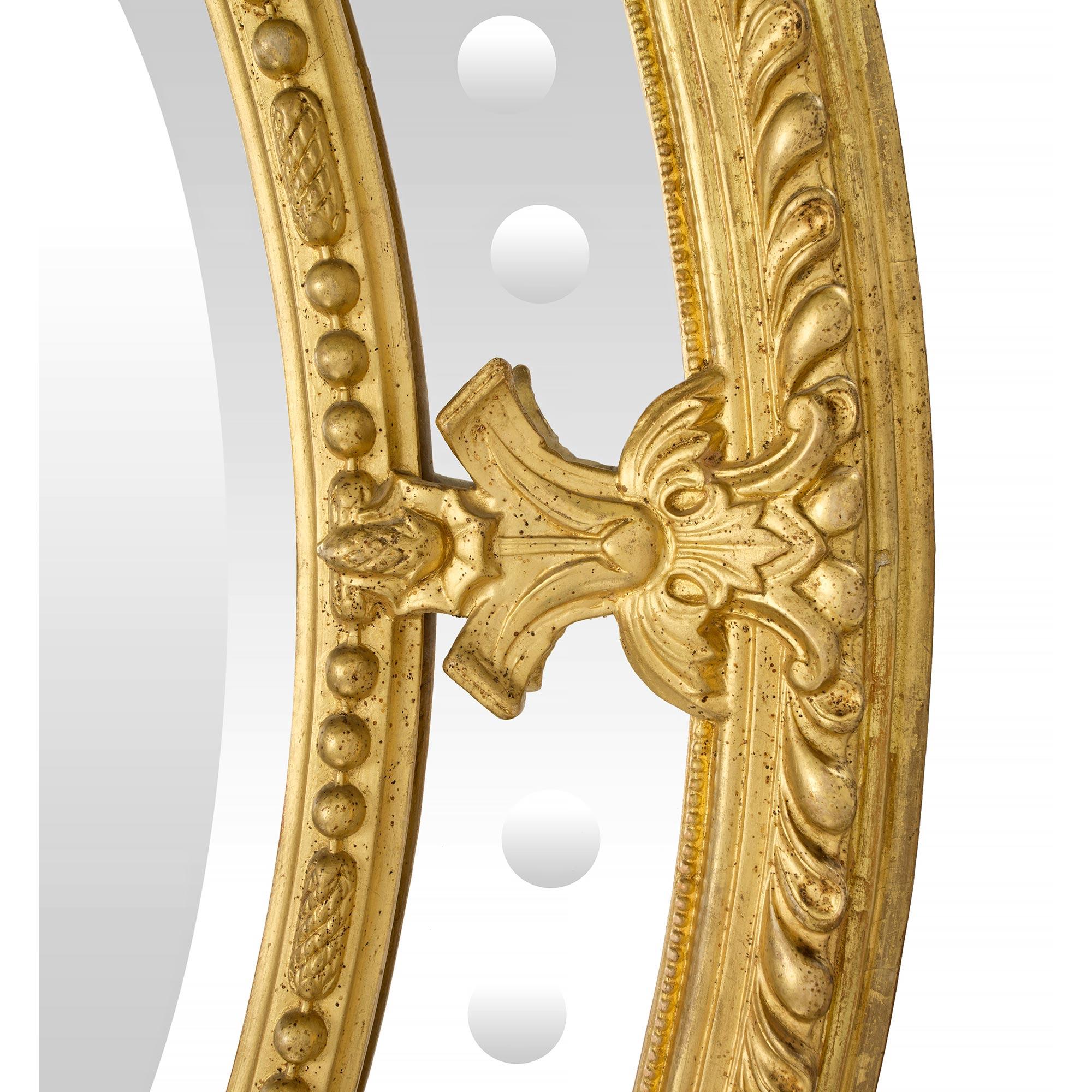 Miroir ovale en bois doré à double cadre de style Louis XVI du 19ème siècle français Bon état - En vente à West Palm Beach, FL