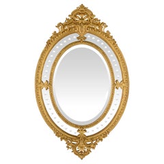 Miroir ovale en bois doré à double cadre de style Louis XVI du 19ème siècle français