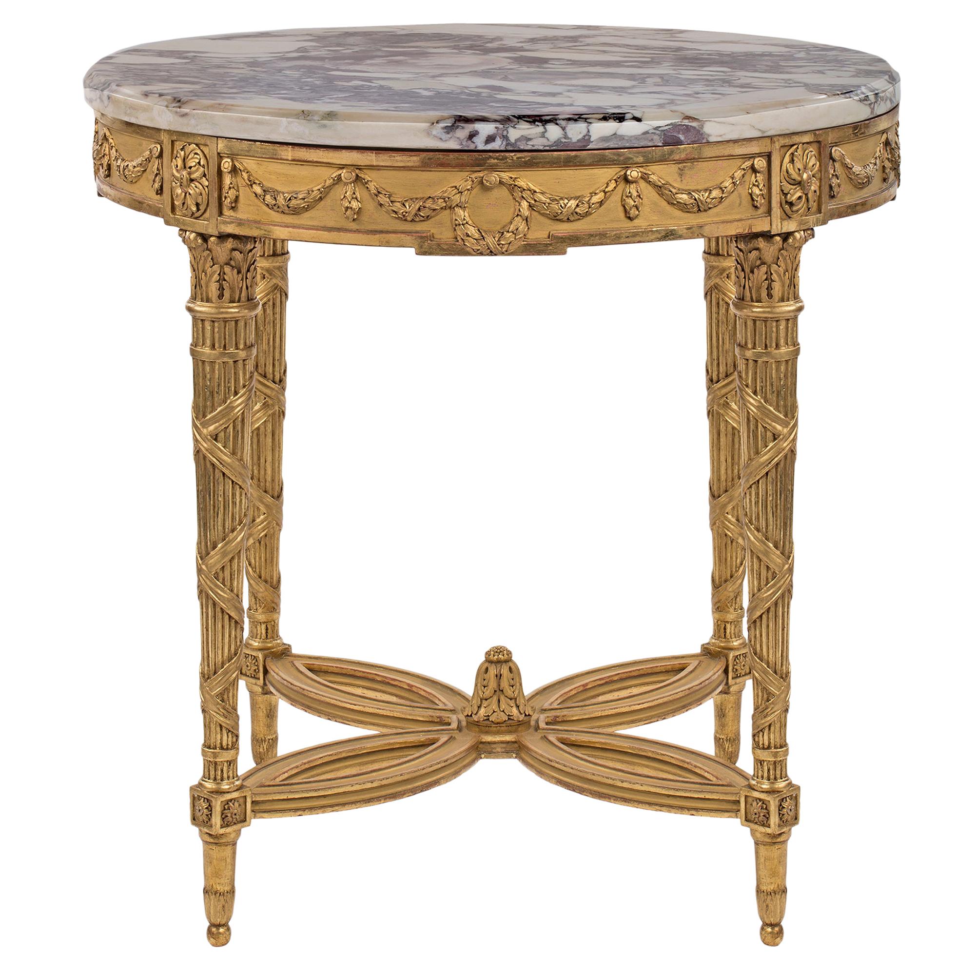 Table centrale de style Louis XVI du 19ème siècle en bois doré et marbre Mdicis français