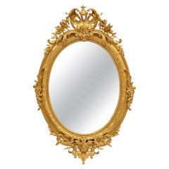 Miroir ovale en bois doré de style Louis XVI du XIXe siècle français