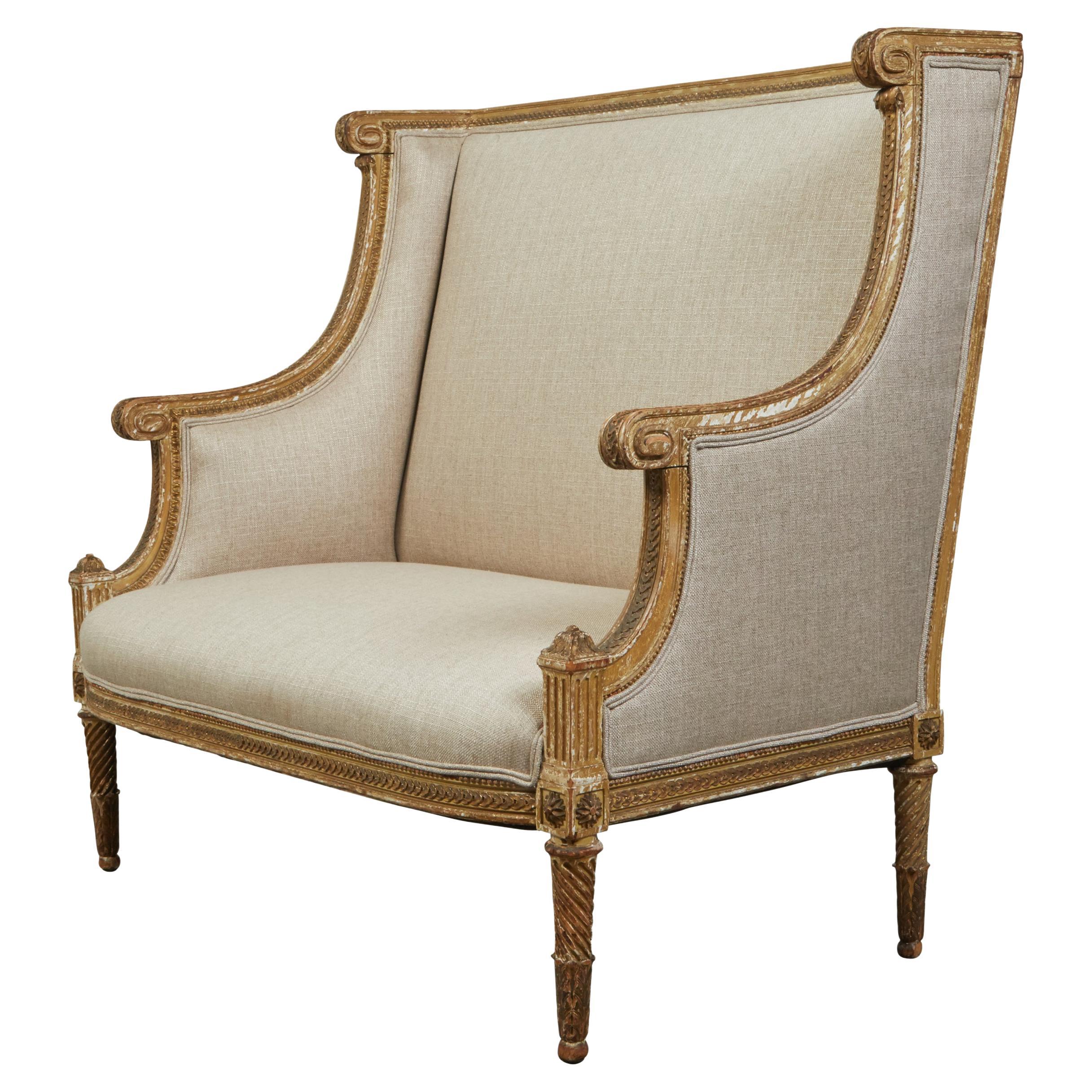 French 19th Century Louis XVI Style Giltwood Wingback Settee with Carved Motifs