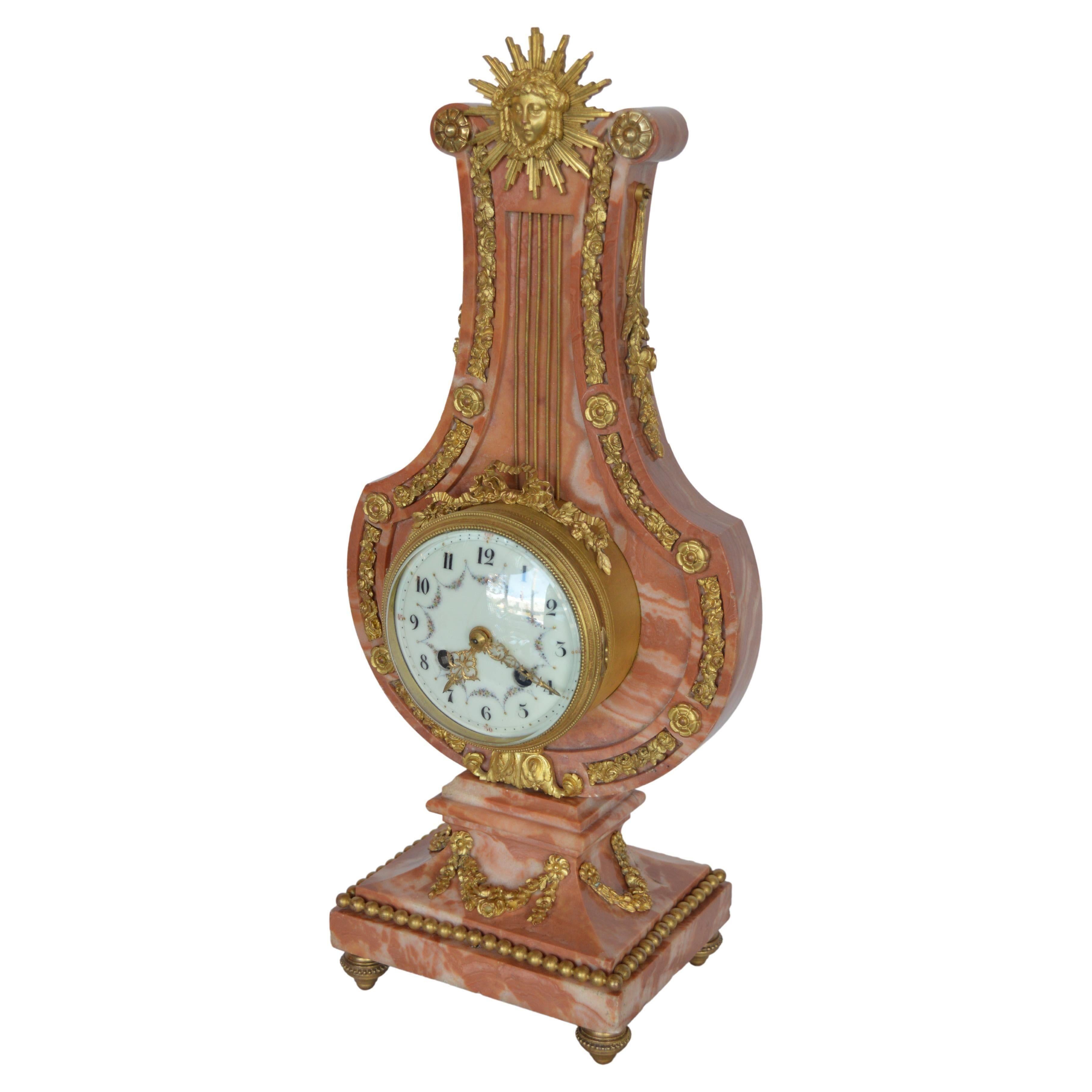 French 19th century Louis XVI style mantel clock signed by J Marti. Made from marble and gilt bronze with porcelain dial.