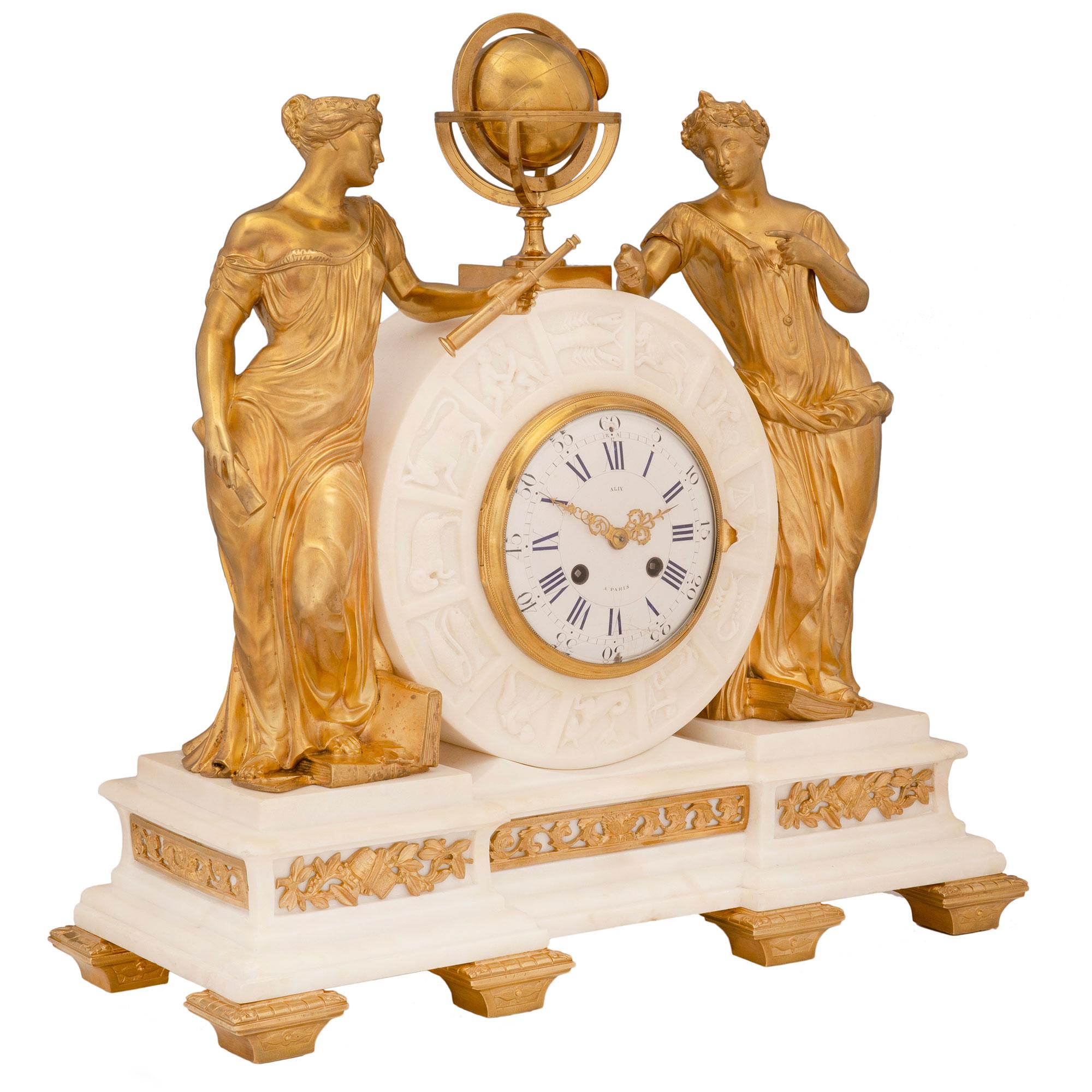 A magnificent French 19th century Louis XVI st. white Carrara marble and ormolu clock, by Alix à Paris. The clock is raised by six elegant tapered ormolu feet below the white Carrara marble base. The base displays a most decorative stepped mottled