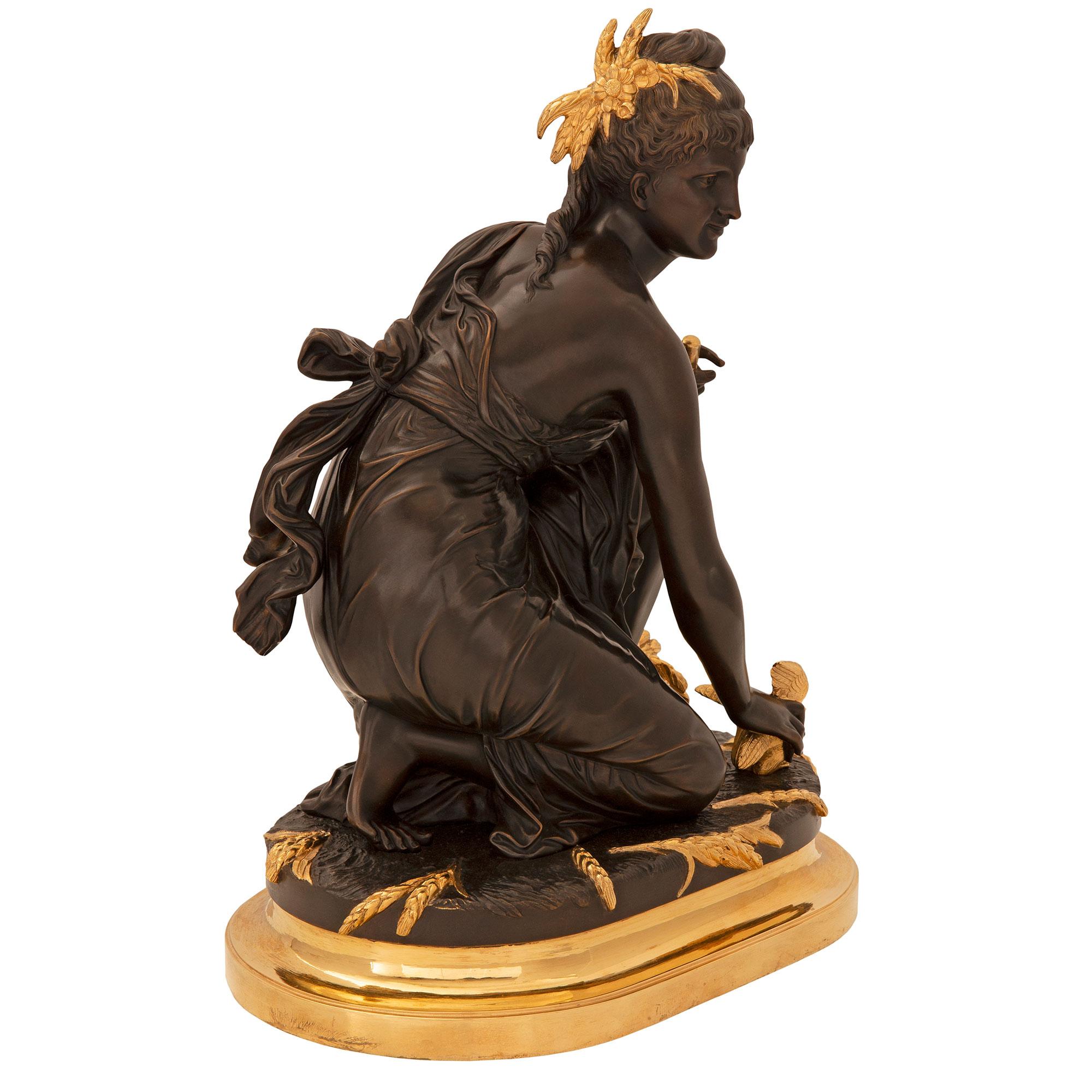 A striking and high quality French 19th century Louis XVI st. ormolu and patinated bronze statue, signed E. Laurent. The statue is raised by an elegant oblong shaped ormolu base with a fine mottled border. Above is a beautiful maiden kneeling on a