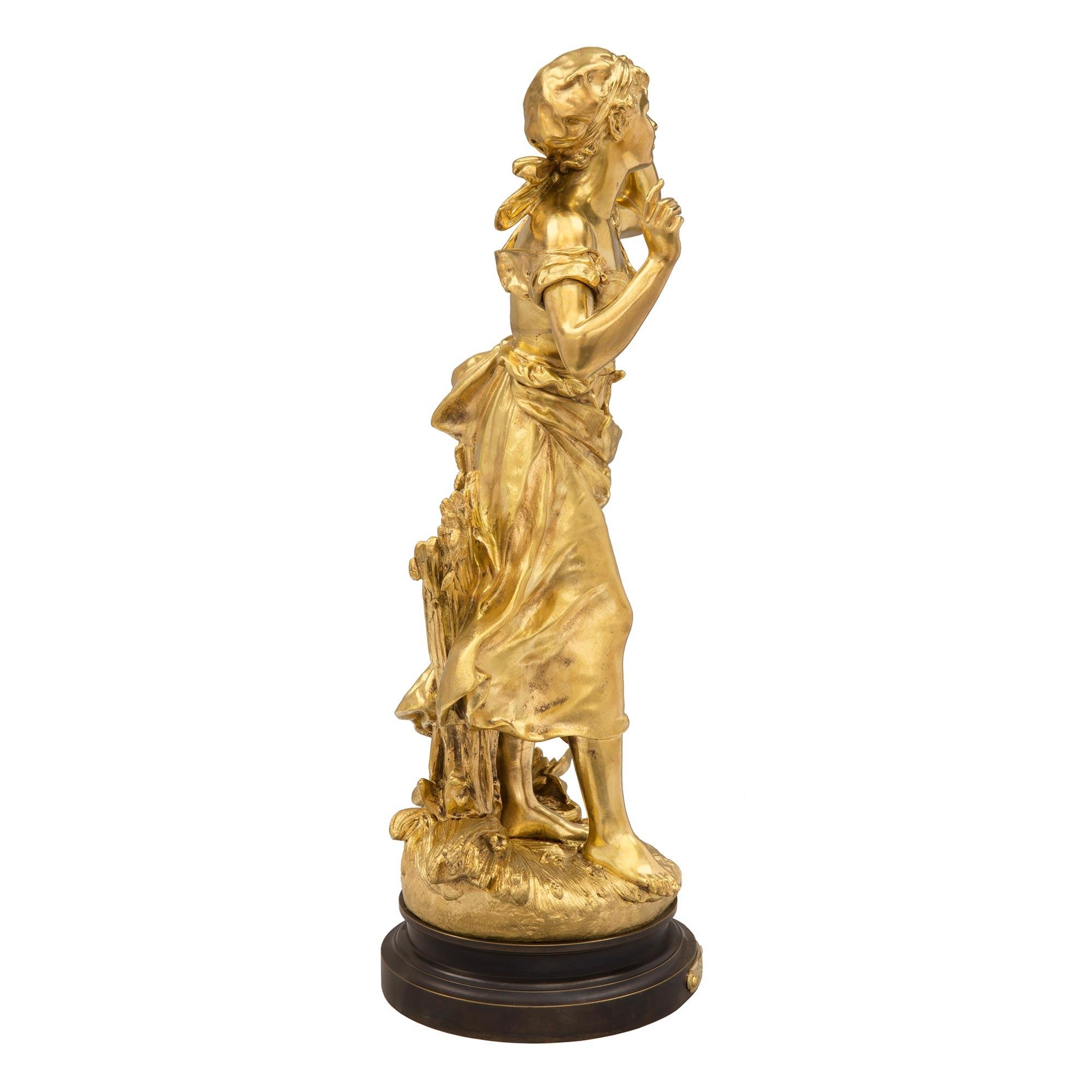 A beautiful French 19th century Louis XVI st. ormolu and patinated bronze statue named 