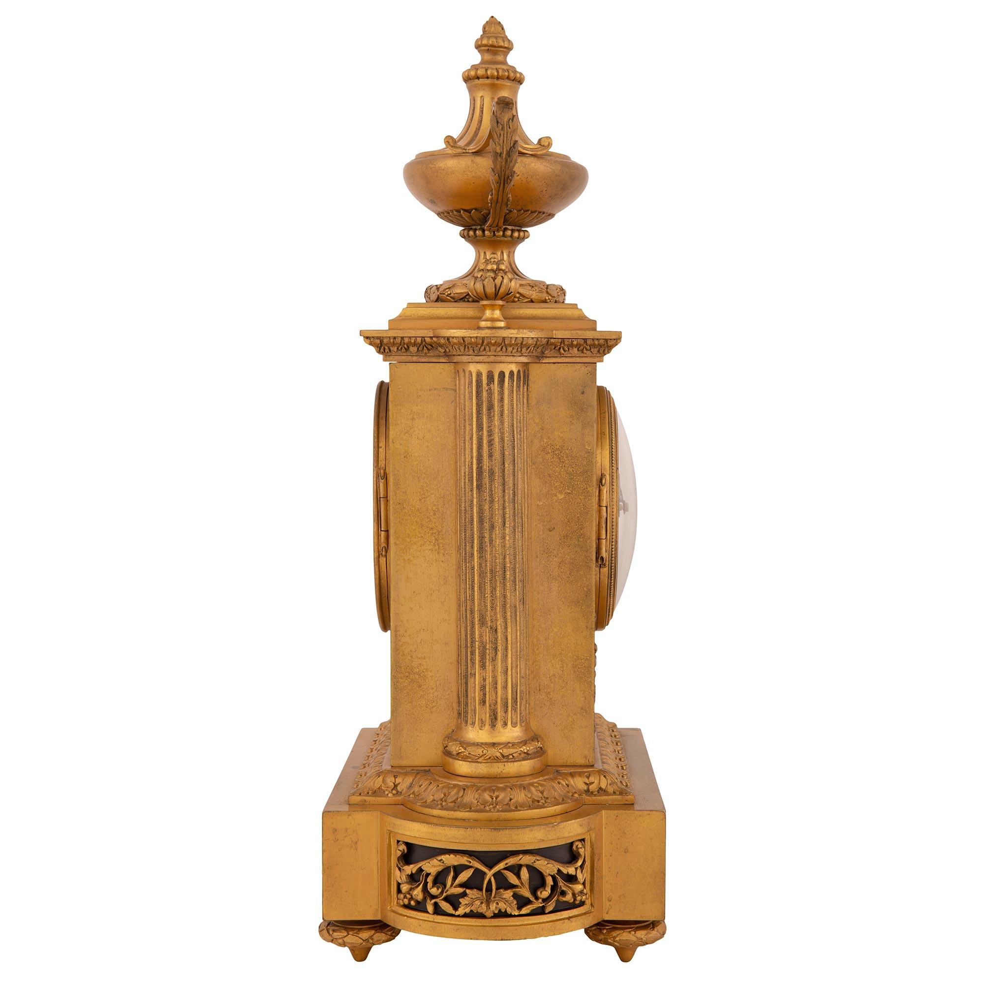Patinated French 19th Century Louis XVI Style Ormolu Clock Signed 'Raingo Freres, Paris For Sale