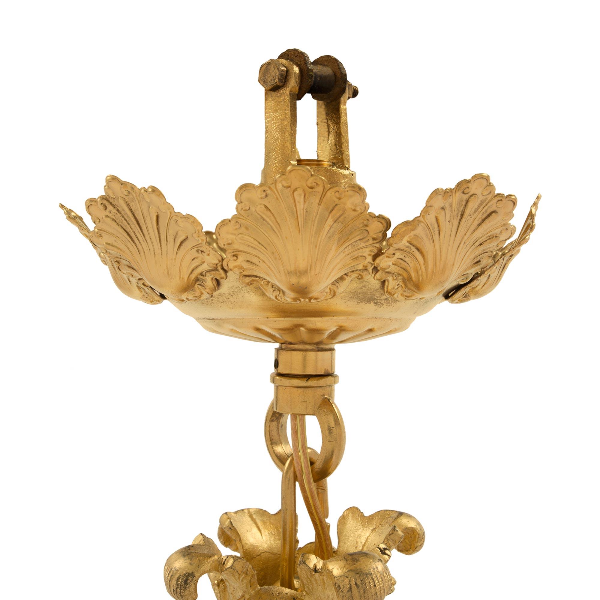 French 19th Century Louis XVI Style Ormolu Four-Arm, Eight-Light Chandelier In Good Condition For Sale In West Palm Beach, FL