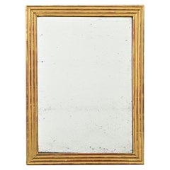 Miroir à cannelures doré de style Louis XVI du 19ème siècle