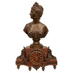 Horloge française du 19ème siècle de style Louis XVI en marbre rouge griotte et bronze