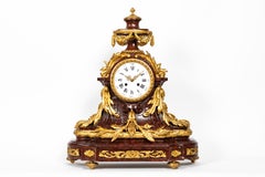 Ensemble d'horloges de style Louis XVI du 19ème siècle en marbre rouge griotte et bronze doré