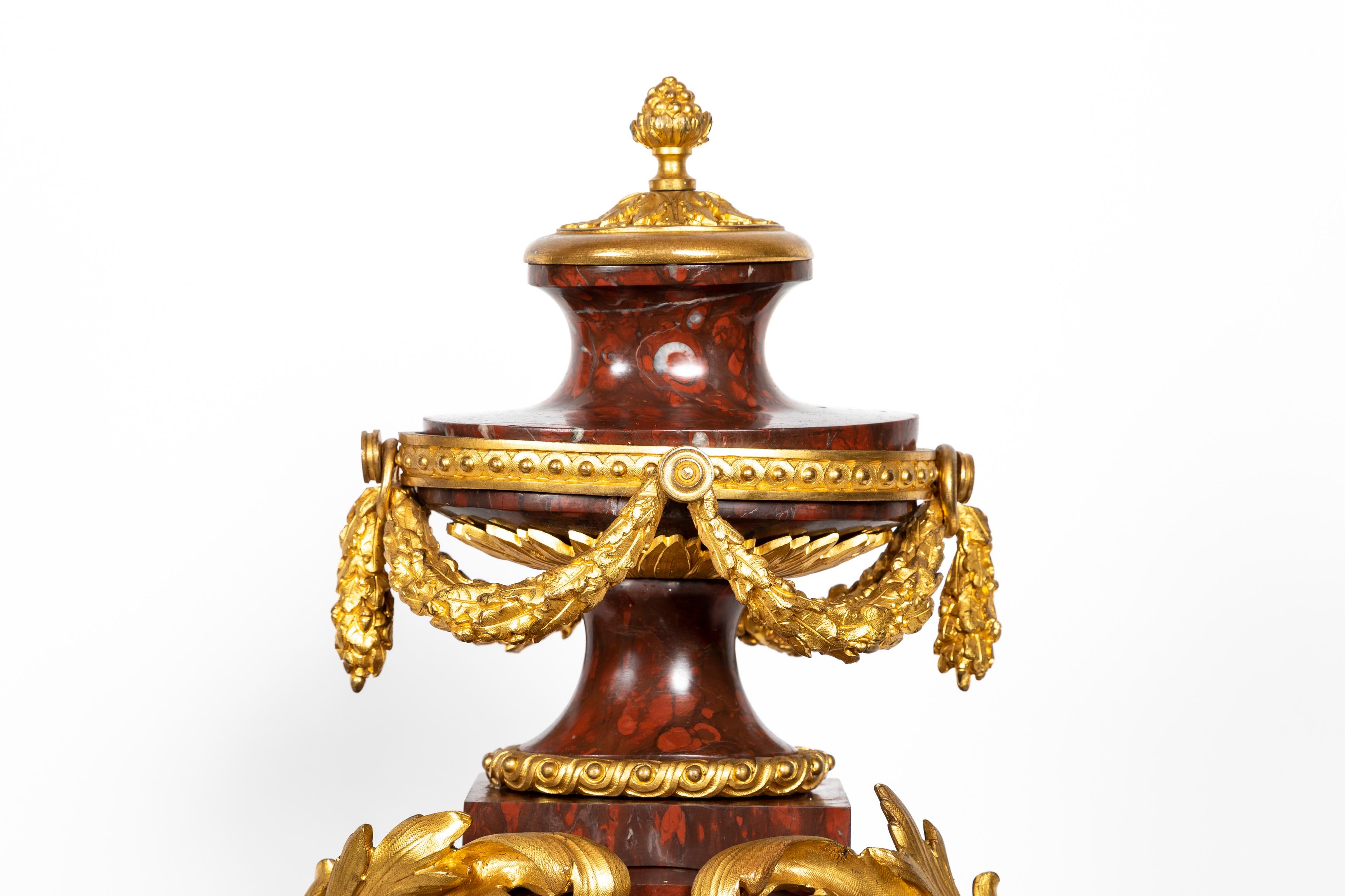 French 19th Century Louis XVI Style Rouge Griotte Marble and Ormolu Clock Set In Good Condition For Sale In New York, NY
