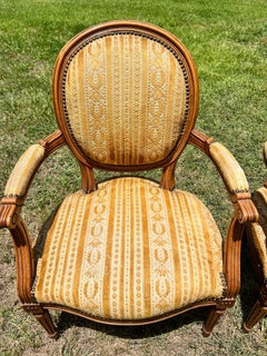 French 19th Century Louis XVI Walnut Arm Chairs - Set of 2