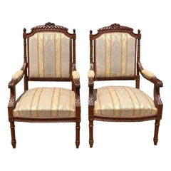 French 19th Century Louis XVI Walnut Arm Chairs - Set of 2